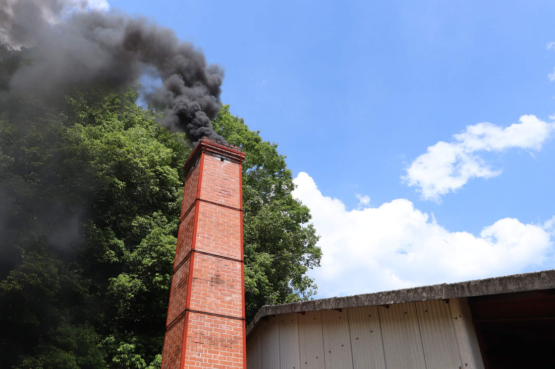Smoke rising from a wood-fired kiln chimney used for Bizen ware