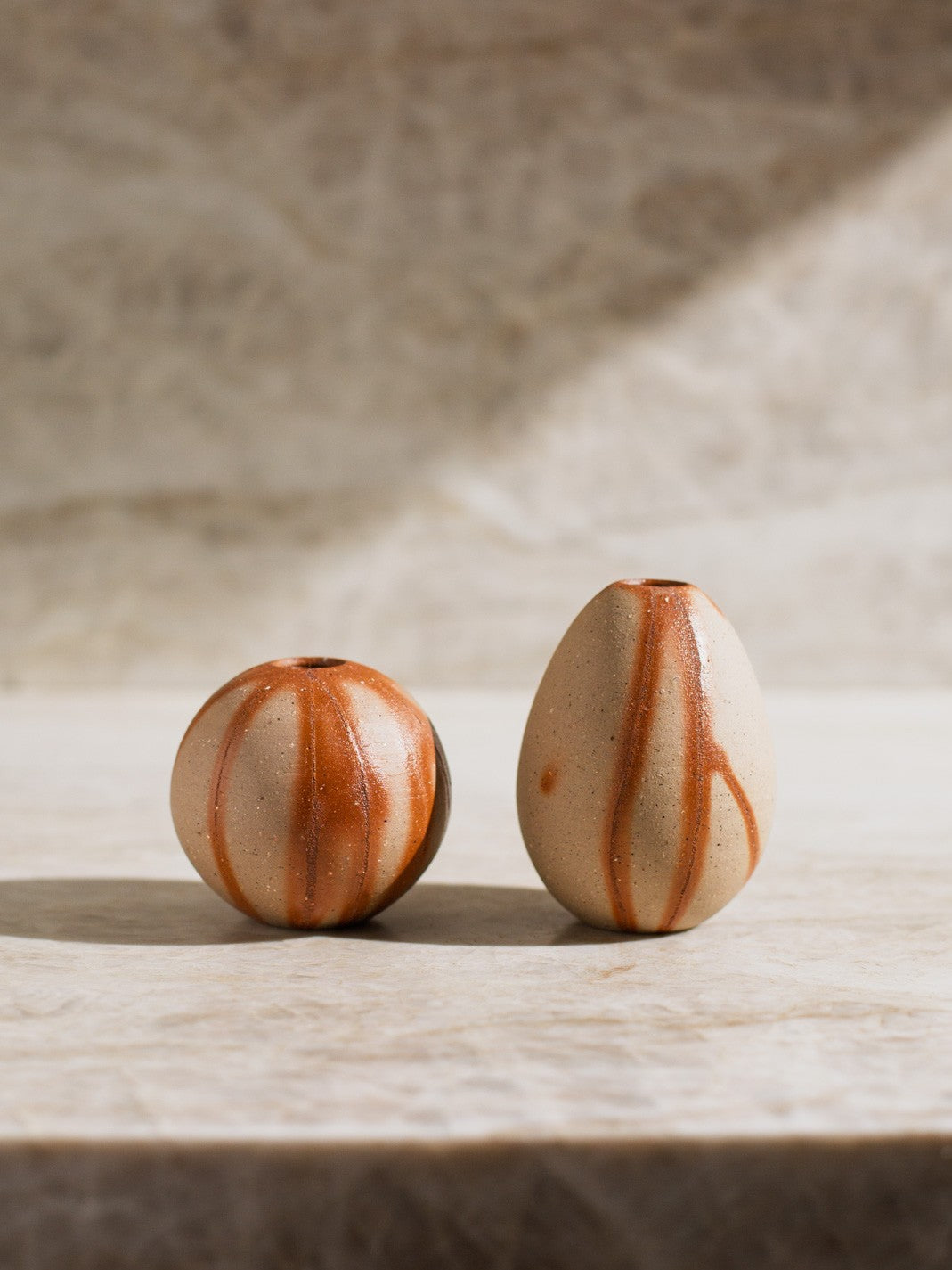 Minimal flower arrangement in Bizen ware bud vase