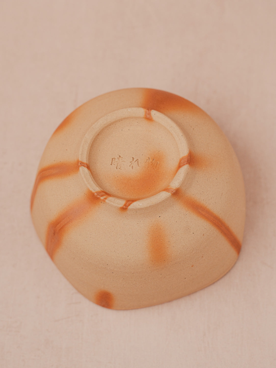 Bottom detail of handmade Bizen ware matcha bowl