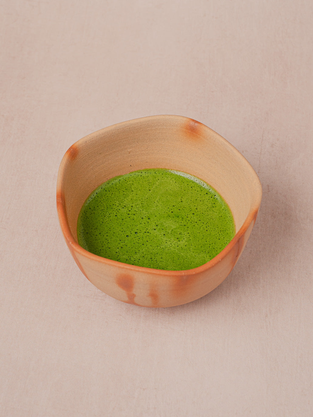 Prepared matcha inside handmade Bizen ware matcha bowl