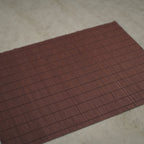 Handmade Bizen ware ceramic plate displayed on dining table