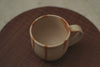 Tea poured into handmade Bizen ware ceramic cup