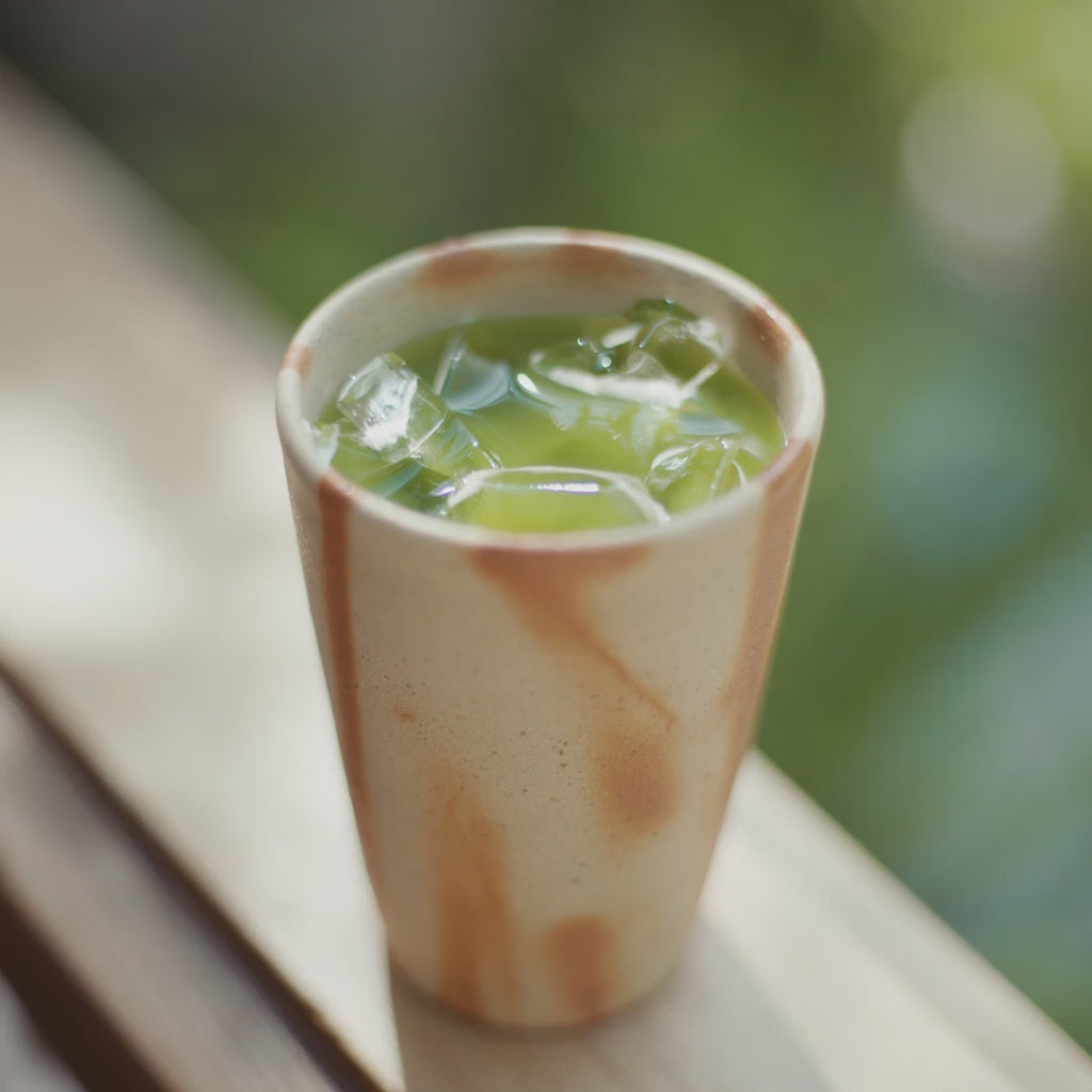 Handmade Japanese ceramic tumbler in everyday use