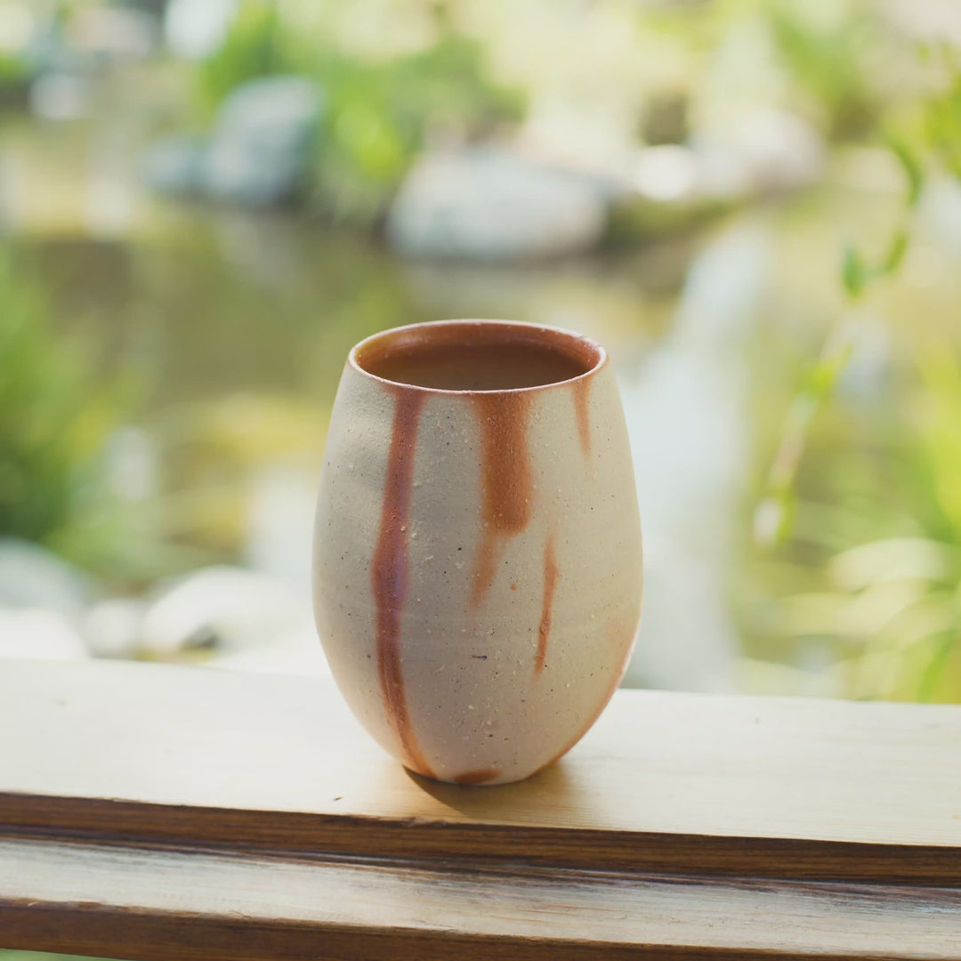Water served in handmade Bizen ware ceramic cup